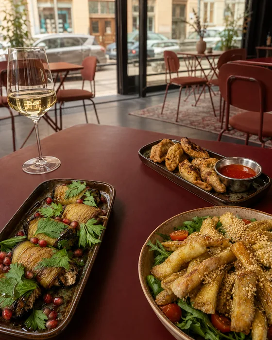 Eggplant rolls, Gurze and crispy eggplant salad on a table at JUNE