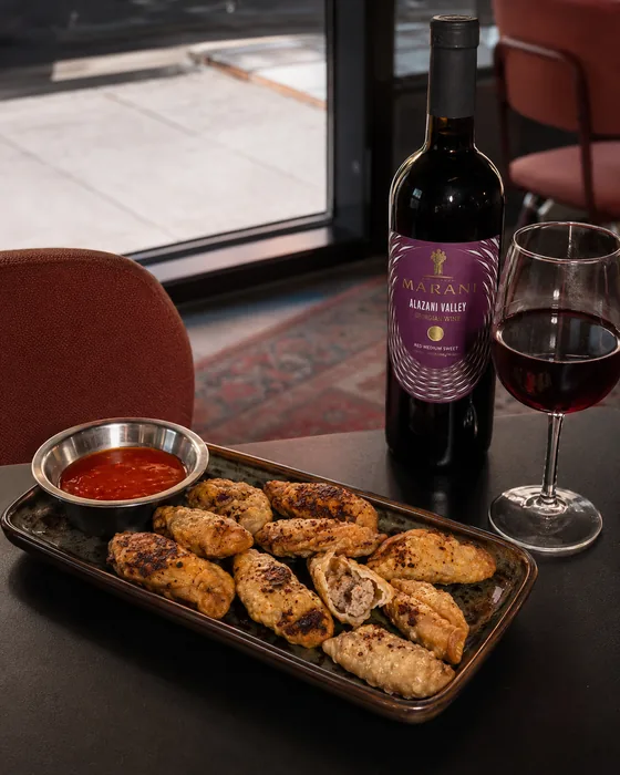 Fried Gurze with a dip and red wine