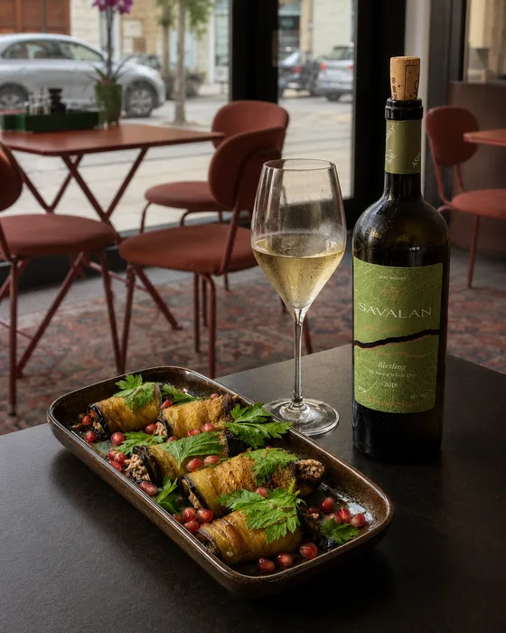 Eggplant rolls with a glass of white wine at JUNE